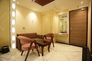 Presidential Room, City View | Living area | 43-inch Smart TV with cable channels, offices