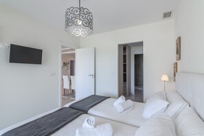 Apartamento | 2 dormitorios y tabla de planchar con plancha