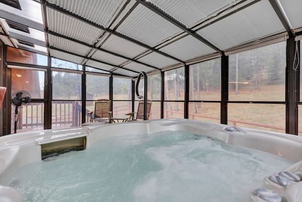 A hot tub area with a view of a forest. - Cozy Mountain Cabin Close to Town (Darby)
