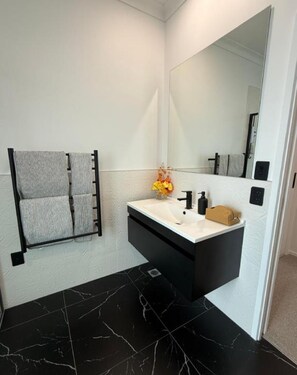 Shower, hair dryer, towels, soap