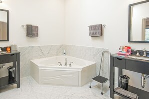 Shower, jetted tub, hair dryer, towels