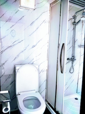 Shower, hair dryer, towels, soap