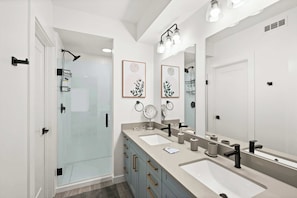 Shower, hair dryer, towels, shampoo