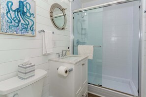 Shower, hair dryer, towels, shampoo