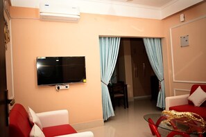 Superior Quadruple Room, Balcony, Hill View | Living area - The Travellers Club (Guwahati)