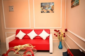 Superior Quadruple Room, Balcony, Hill View | Living area - The Travellers Club (Guwahati)