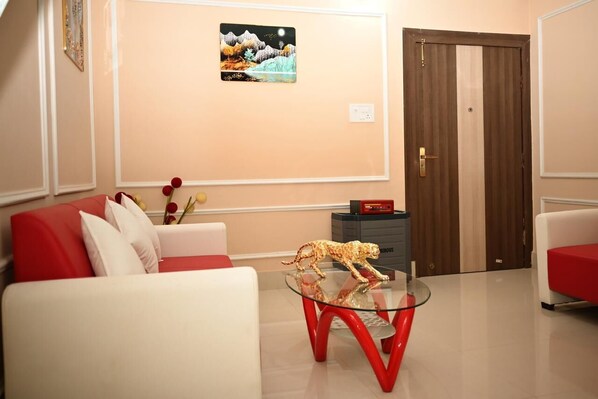 Superior Quadruple Room, Balcony, Hill View | Living area - The Travellers Club (Guwahati)