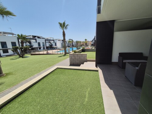 Garden-view Flat in Punta Prima