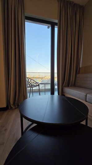Deluxe Suite, Balcony, Marina View | Desk, blackout drapes, free WiFi