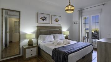 Apartamento | 1 dormitorio y tabla de planchar con plancha