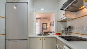 Private kitchen - Seaside Apartment in Isla Canela (Ayamonte)