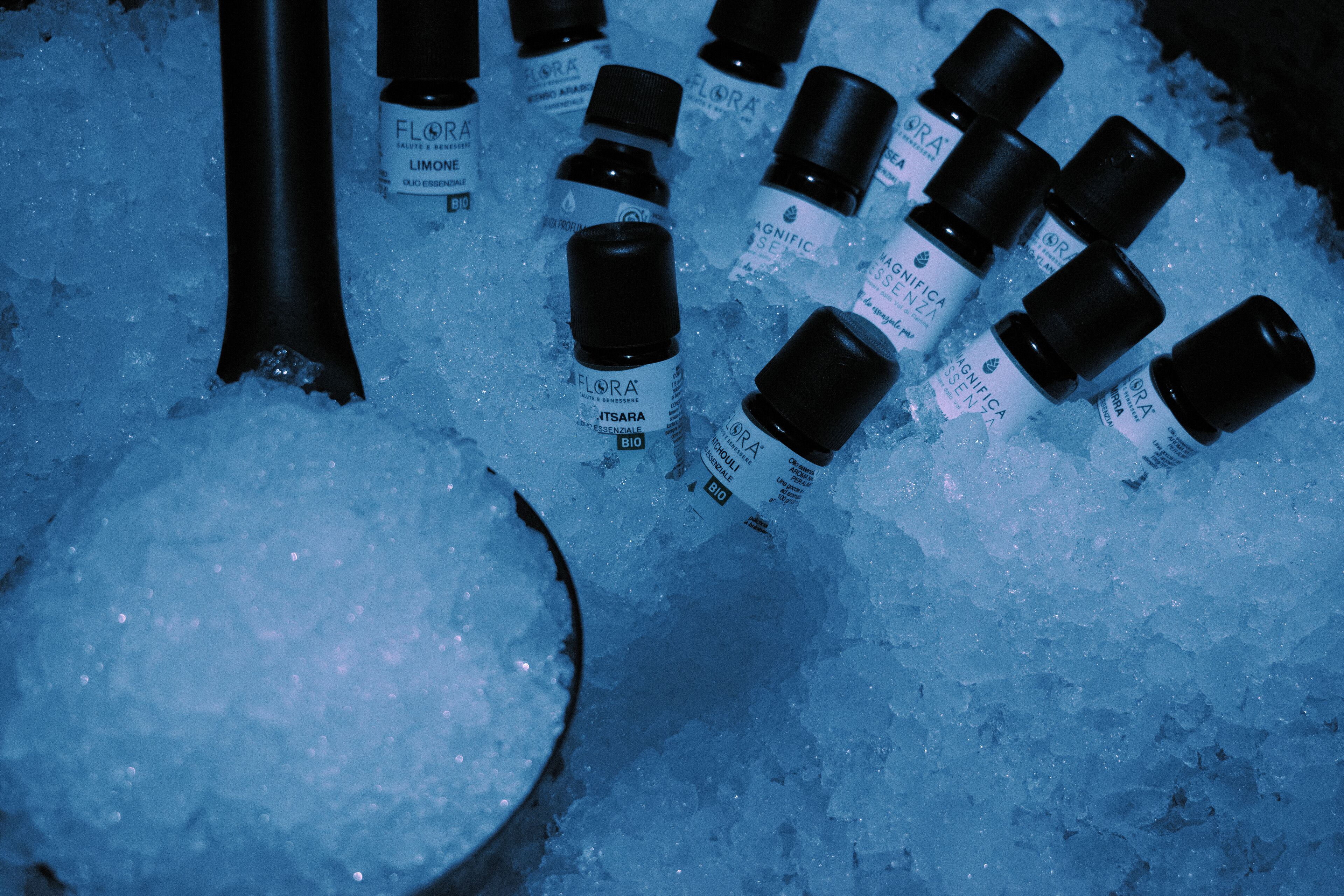 Several small bottles labeled 'FLORA' on ice.