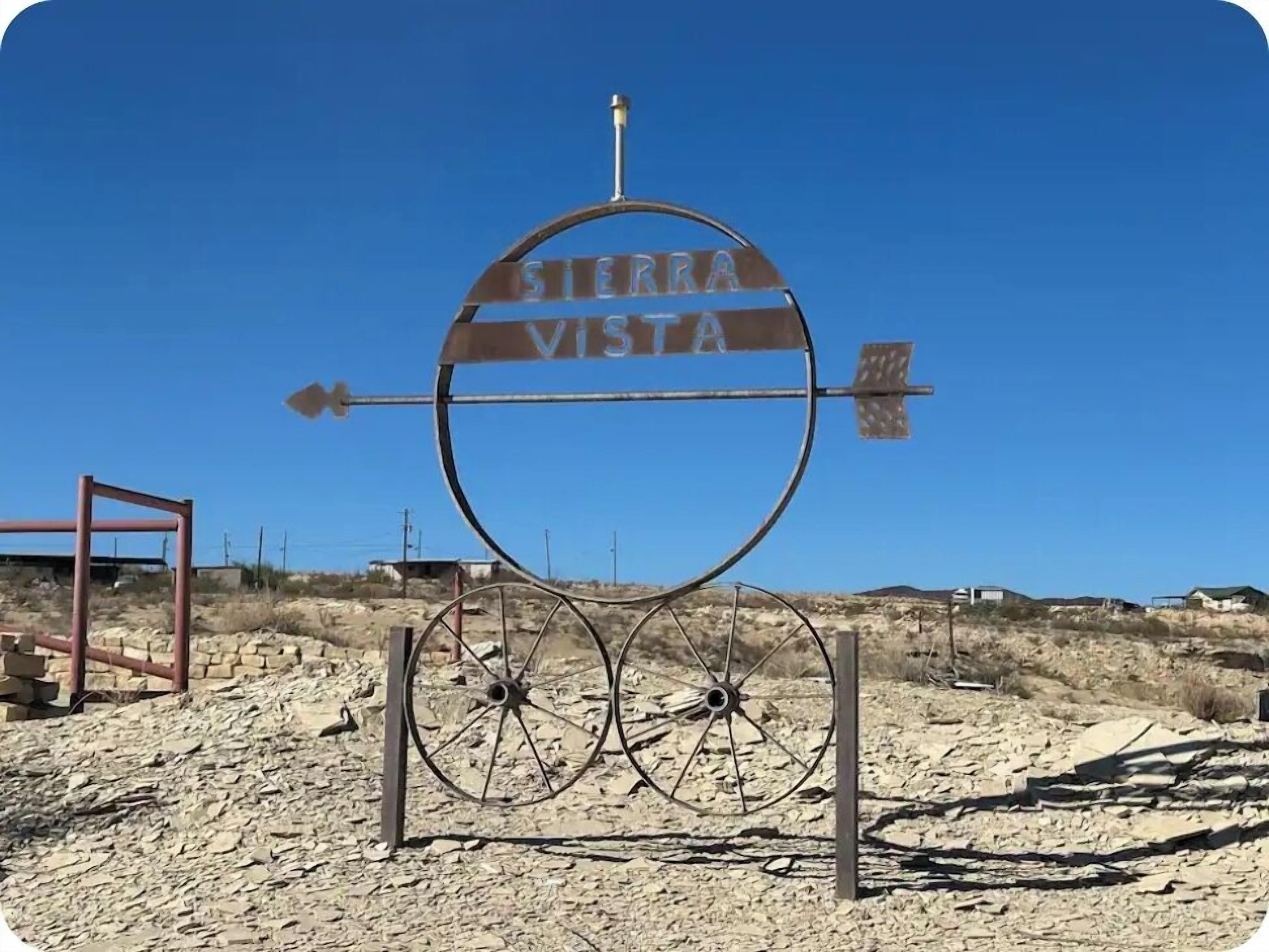A sign with the text "Sierra Vista" and directional arrows.