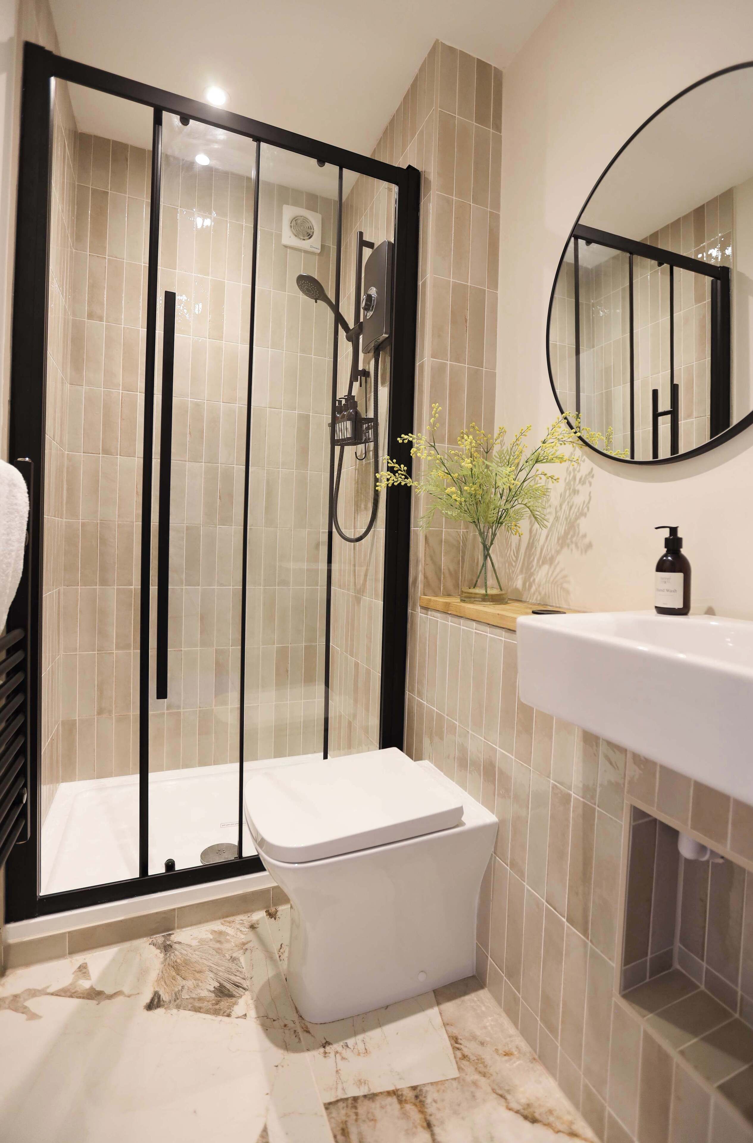 Shower, hair dryer, towels, shampoo