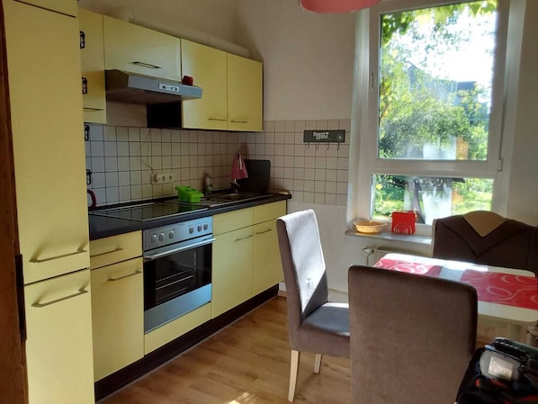 Fridge, microwave, stovetop, coffee/tea maker