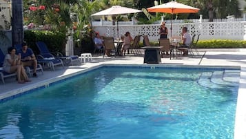 Outdoor pool, open 10:00 AM to 6:00 PM, pool loungers
