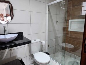 Shower, hair dryer, towels, toilet paper