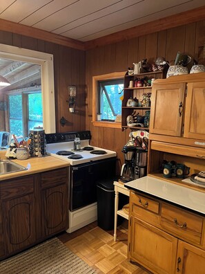 Fridge, microwave, stovetop, coffee/tea maker
