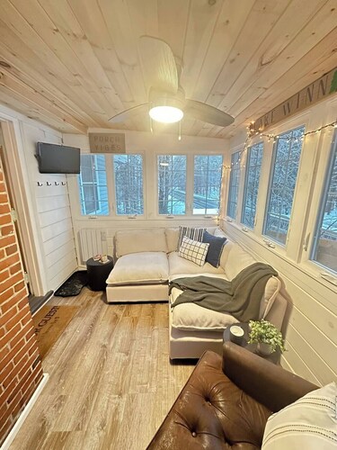 Stylish 2BR Retreat w/Sunroom + Fireplace Near Gunstock. Across from Lake Winnie
