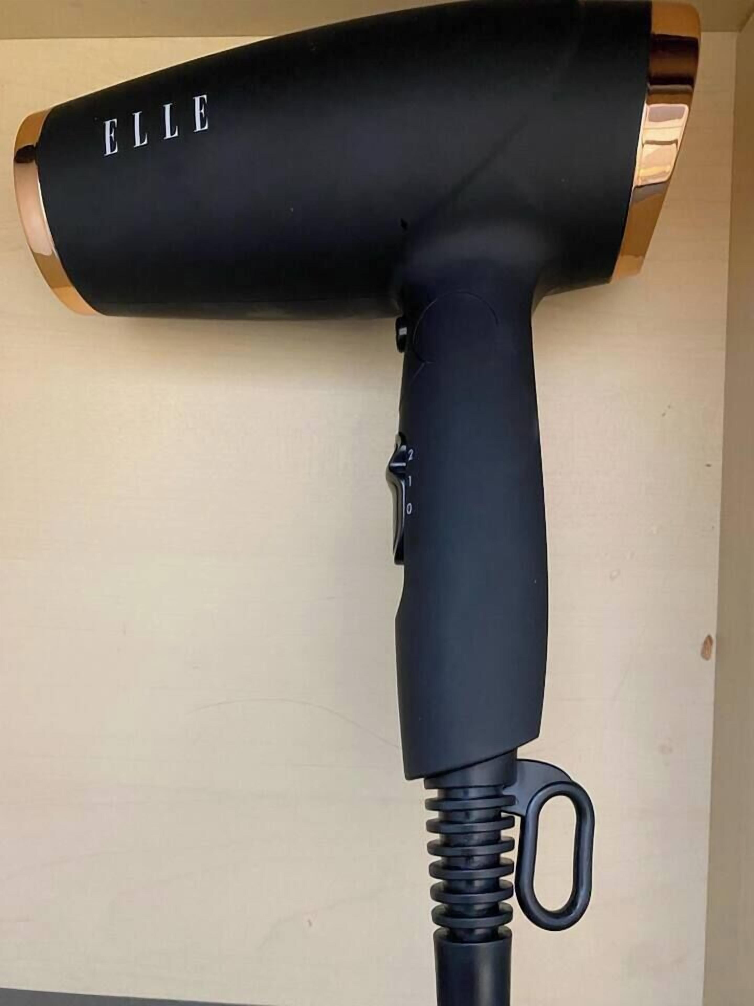 A black hair dryer with the brand name "ELLE" on it.