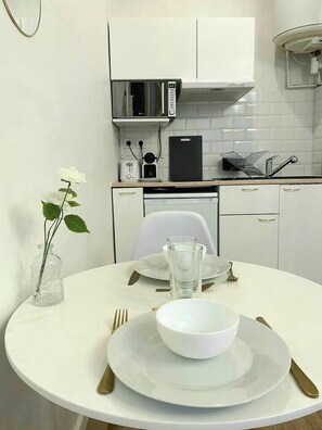 Fridge, microwave, coffee/tea maker, cookware/dishes/utensils