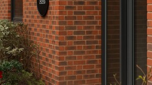 A brick building with a black address sign, a window, and a door. - 2 Bedroom Accessible Step-Free Central  (Liverpool)