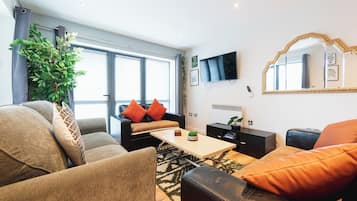 Comfort Apartment | Living area | Flat-screen TV