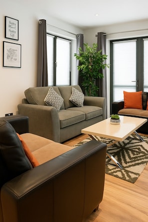 Appartement Confort | Coin séjour | Télévision à écran plat