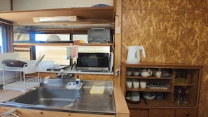 Fridge, microwave, stovetop, cookware/dishes/utensils
