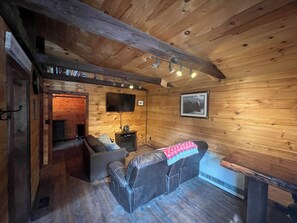 Living area - Charming cabin in wonderful New Sweden with 80 acres of woods and trails (New Sweden)