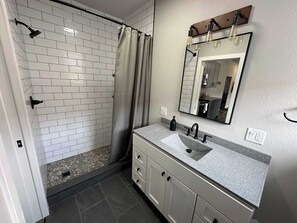 Shower, hair dryer, towels