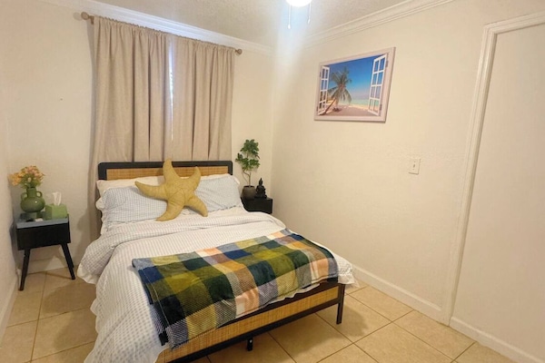 Full size bed, duvet and 2 sets of pillows. Fits two adults. Blackout curtains.