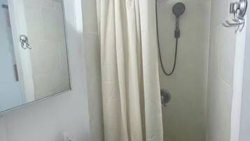 Shower, towels, soap, toilet paper