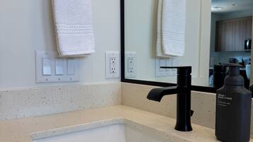 Hair dryer, towels, soap, toilet paper