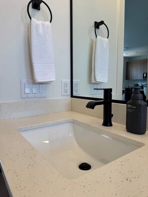 Hair dryer, towels, soap, toilet paper