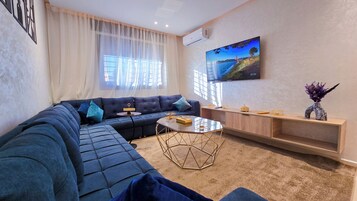 Deluxe Penthouse, 2 Bedrooms, Garden View | Living area | Flat-screen TV