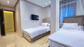 Deluxe Penthouse, 2 Bedrooms, Garden View | Iron/ironing board, free WiFi