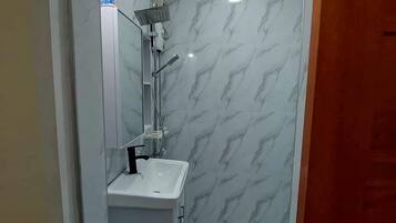 Shower, towels, soap, toilet paper