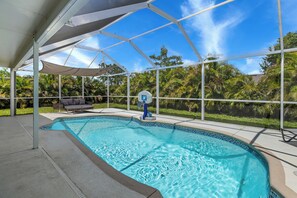 Outdoor pool, a heated pool - Heated Lanai Pool • Epic Game Room • 15 Min to Beach • Private Yard (Cape Coral)