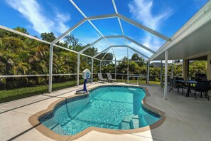 Outdoor pool, a heated pool - Heated Lanai Pool • Epic Game Room • 15 Min to Beach • Private Yard (Cape Coral)