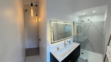 Shower, hair dryer, towels, soap