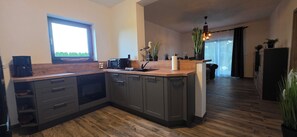 Dishwasher, coffee/tea maker, cookware/dishes/utensils