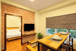 Deluxe Studio | Living area | 42-inch flat-screen TV with digital channels