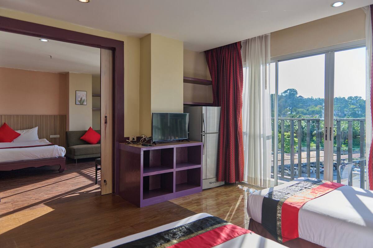 Family Room, Balcony, City View | In-room safe, desk, laptop workspace, iron/ironing board