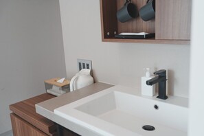 Economy Double Room, City View | Bathroom | Shower, hair dryer, slippers, towels
