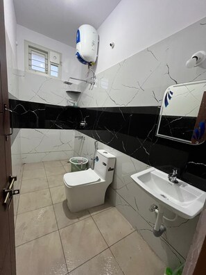 Family Double Room, Balcony, Garden View | Bathroom | Shower, slippers, towels, soap - shree stay in (Chikkamagaluru)