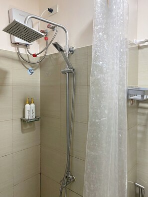 Shower, hair dryer, towels, toilet paper