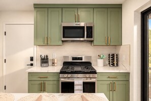 Gas range with griddle, microwave, full knife set, and a stocked spice rack. - Casa Del Rey Old Town Retreat | Pool & Casita (Scottsdale)