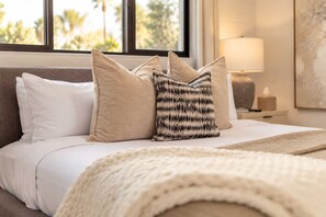 A neatly made bed with white bedding and a beige throw blanket. - Casa Del Rey Old Town Retreat | Pool & Casita (Scottsdale)