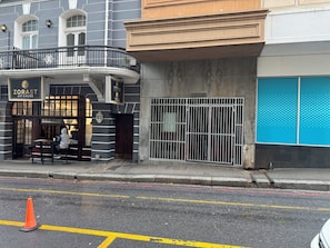 A building with a storefront named 'ZORAST' and a barred entrance. - Flexistay Hotel (Cape Town)